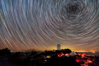 The Dark Energy Spectroscopic Instrument maps the night sky from the Nicholas U. Mayall 4-meter Telescope in Arizona.